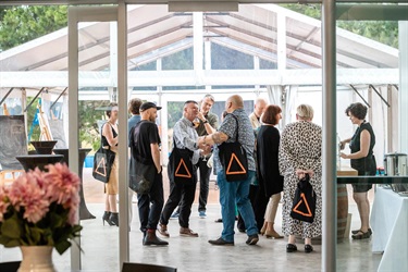 People mingling in a pavillion