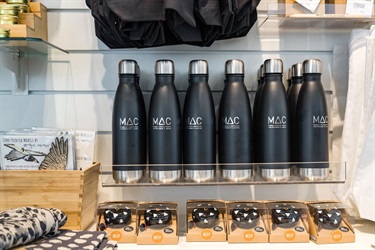 Gift shop merchandise with prominent MAC water flasks