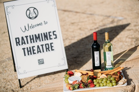 Welcome board for Rathmines Theatre next to a wine and grazing plate